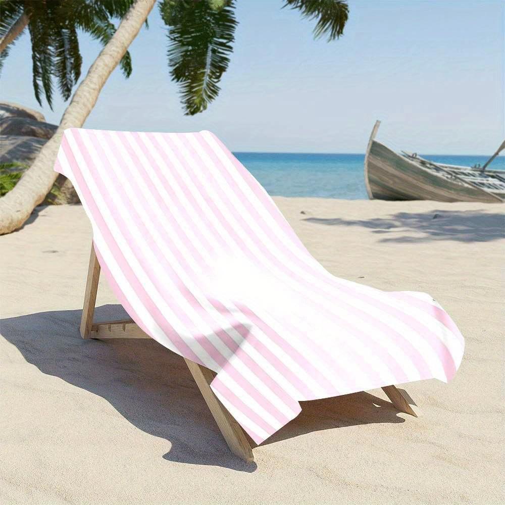 Stylish pink and white striped beach towel, made of polyester, machine washable, suitable for travel, pool, and beach decoration