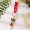 European & American Sweet Butterfly Daisy Silicone Beaded Keychain with Leather Bow Pendant