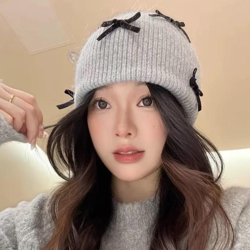 Korean ins autumn and winter warm sweet wool hat women contrasting color bow knitted ear protector face small pile hat tide