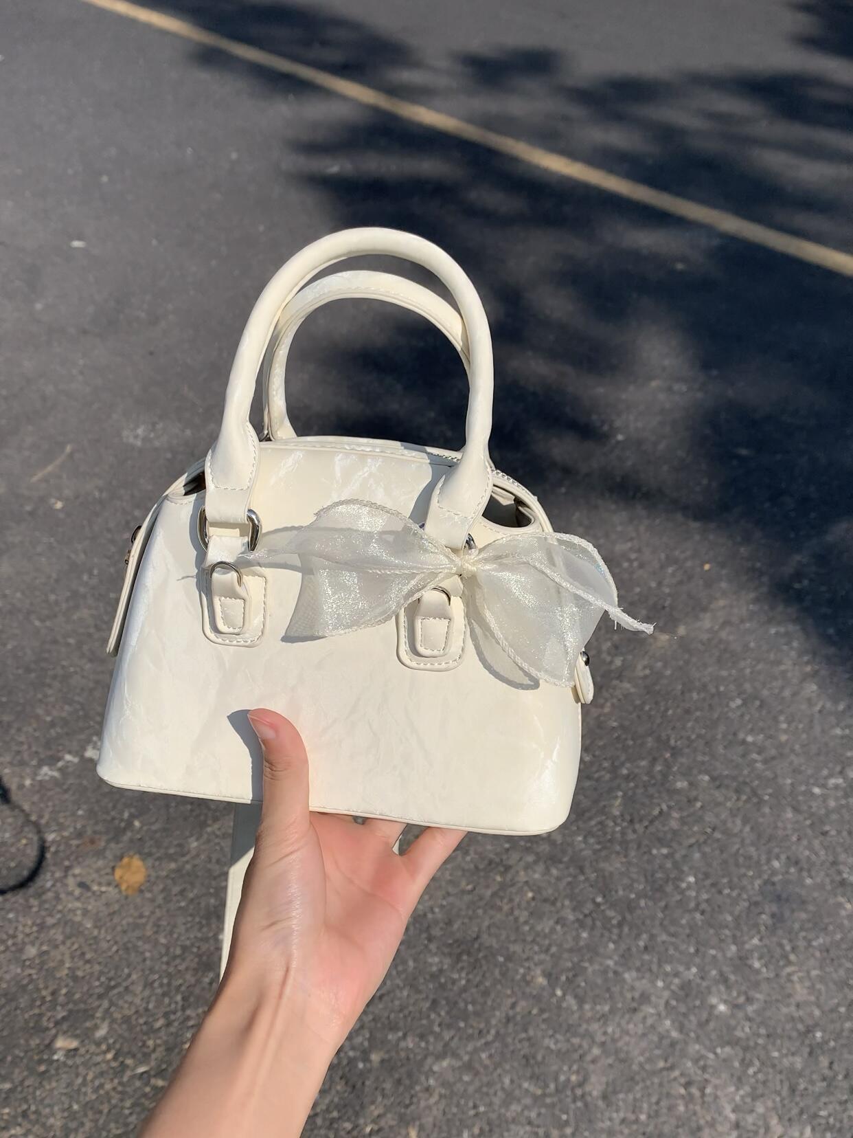 

Textured new high-end simple fashion niche portable fashion shoulder messenger bag белый