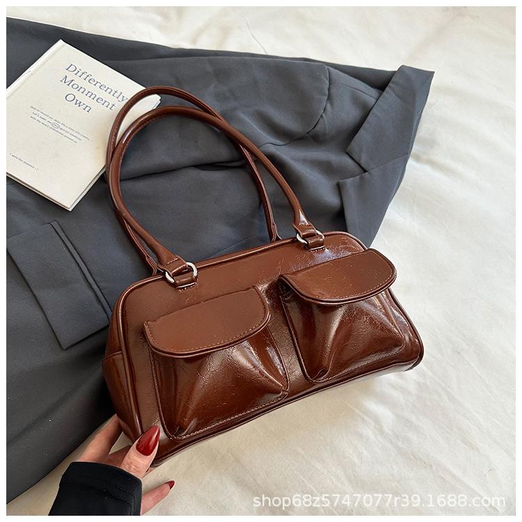 

Korean version 2025 new commuter shoulder handbag niche armpit large capacity multi-pocket niche design bag for women коричневый