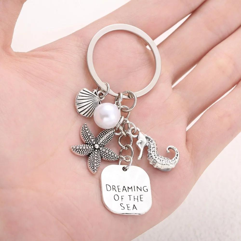 

Креативные брелки для ключей с морскими животными серебристого цвета, морской конек, морская звезда, белый жемчуг, металлические брелки, модное украшение серебряный