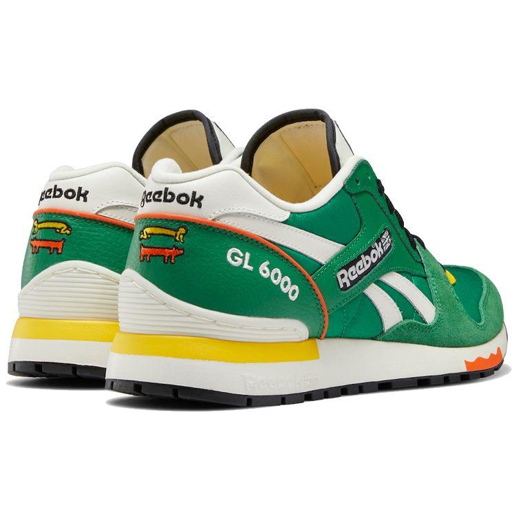 Keith Haring x Reebok GL 6000 Hund und Mensch Fersenprint Unisex Sneaker Grün Glen-Grün Kreide GZ1460