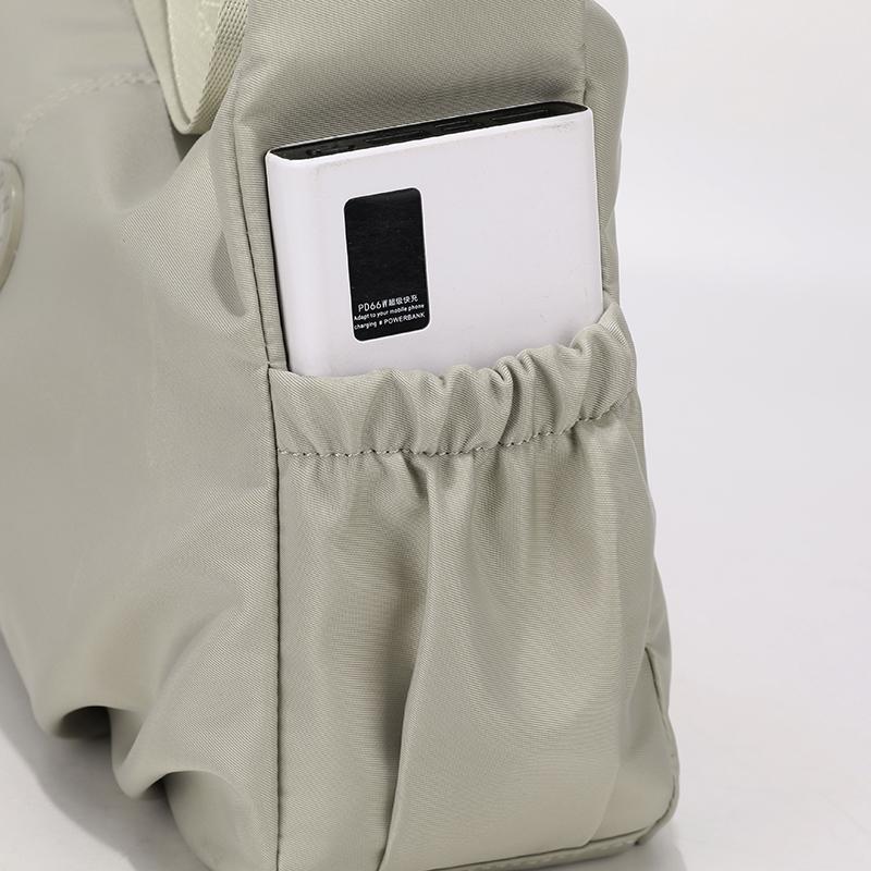 Elegant Slouch Shoulder Bag with Top Zip Closure Adjustable Strap Geometric Stitching and Smooth Nylon Fabric for Modern Daily Wear and Commuting