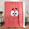 A simple pink background with a smiling cartoon face and wide eyes. for all seasons blanket lunch break throw gift