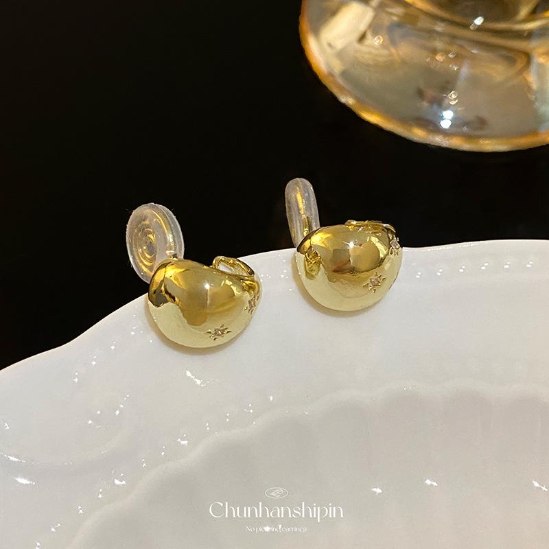 

French retro octagram water drop ear clips without holes, high-end micro-inlaid zircon stud earrings,women s light luxury mosquito coil disc earrings.