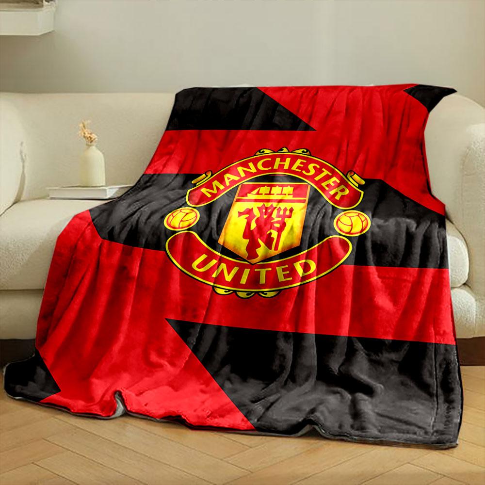Diagonal red and black zigzag pattern with a central Manchester United logo. for all seasons blanket lunch break throw gift