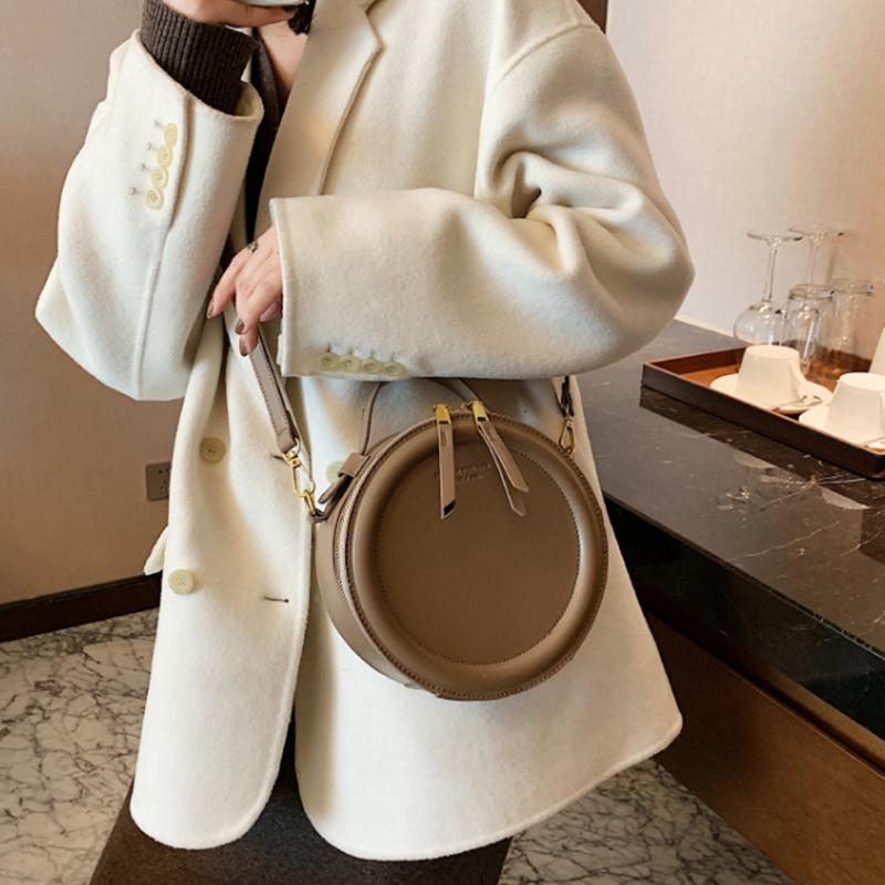 Jednobarevná crossbody kabelka pro ženy kulatá malá kabelka Módní návrhářské tašky PU kožená taška přes rameno Dámské peněženky na zip