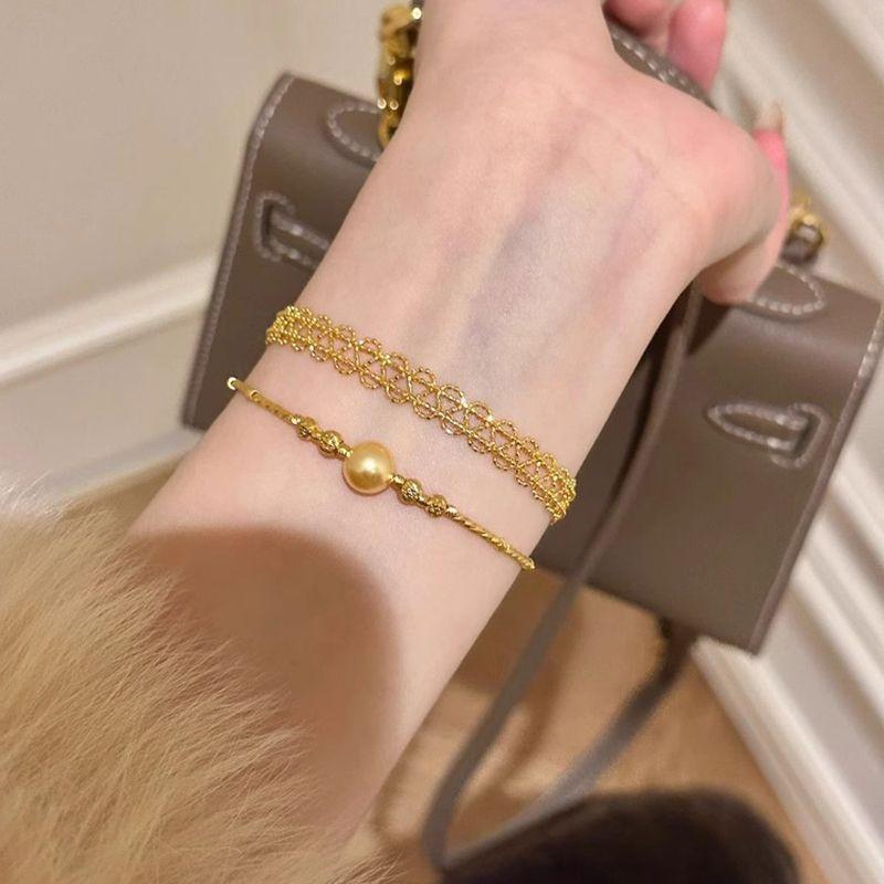 Stacked high-end ribbon gold lace bracelet women's light luxury ins niche high-end retro pearl bracelet bracelet bracelet