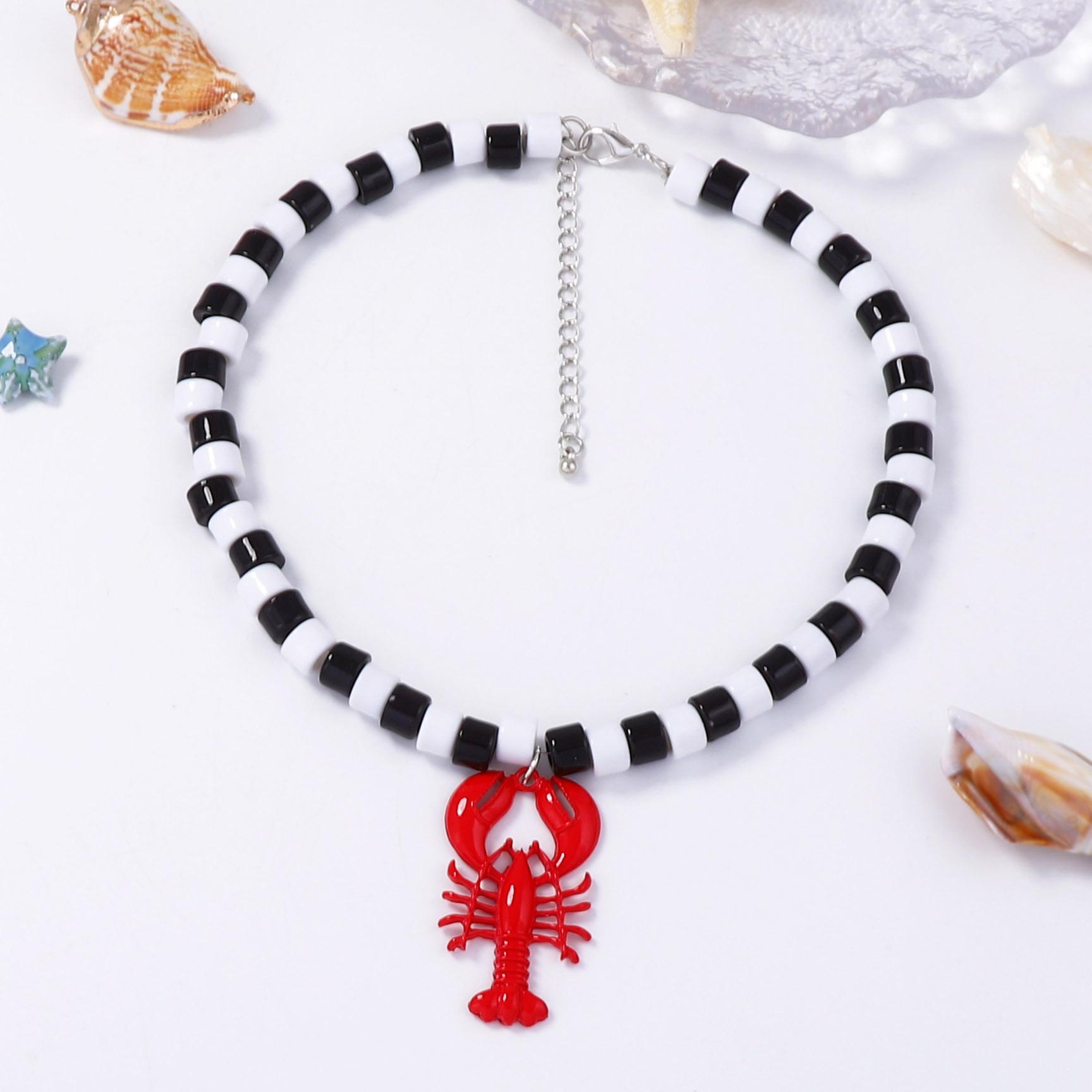 Simple and fashionable beach wind alloy dripping lobster pendant women s necklace black and white beaded high-end sense necklace