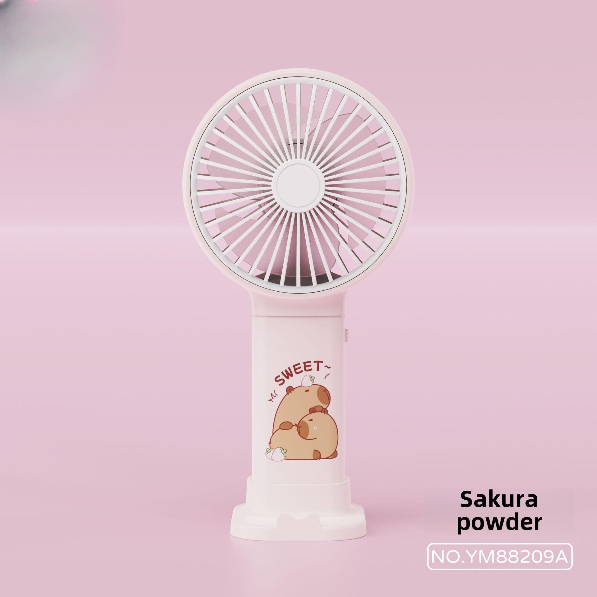 

Принт капибары Ручной летний прохладный маленький вентилятор Подставка для мобильного телефона Однотонный USB-зарядка Подарочный вентилятор Восточный настольный вентилятор розовый