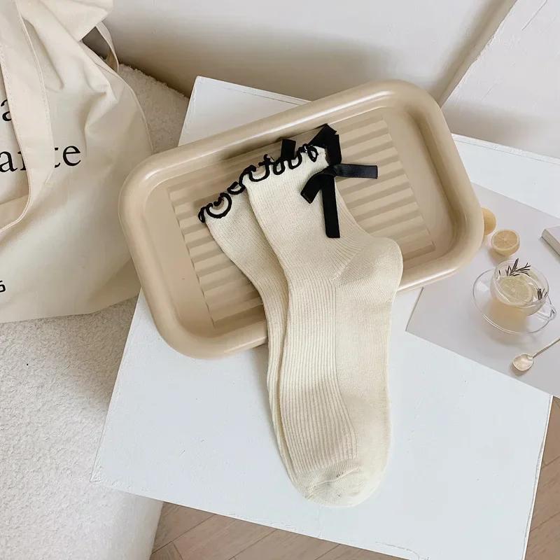 Japanese JK Sweet Bowknot Tied Middle Tube Socks Women Heel Bow Casual Black White Pile Socks Girls Sports Cotton Socks