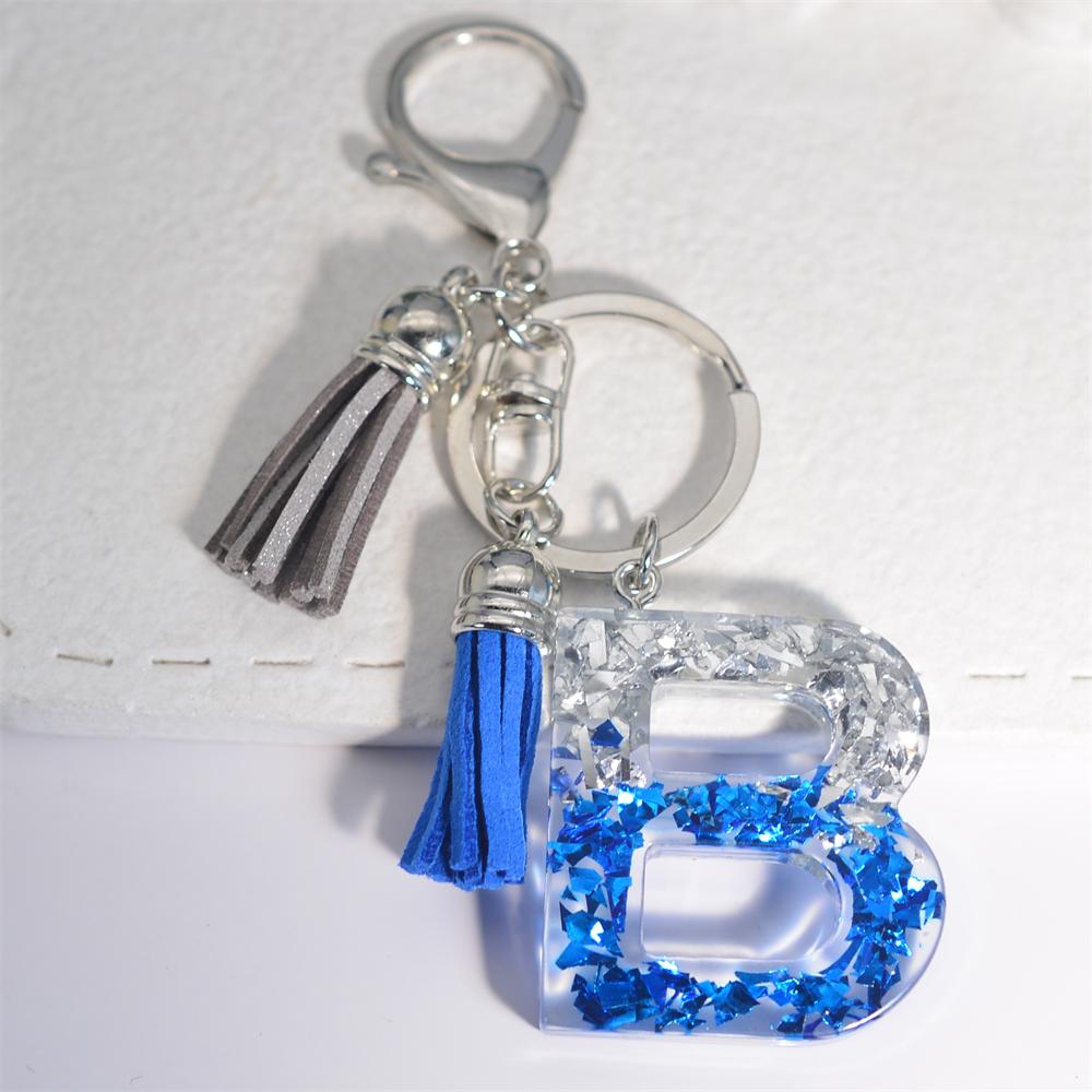 Креативные брелки из смолы с 26 буквами и кисточками — фото 9