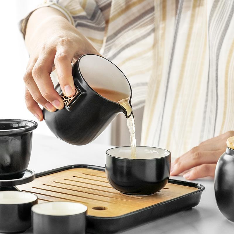 Portable four-load ceramic travel kung fu tea set, one pot and four cups of ceramic simple gift box, gift set