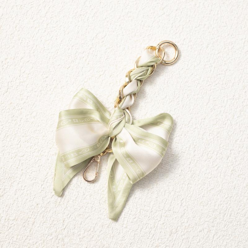 Elegant Hand-Woven Scarf Chain with Bow Decoration Pendant for Bag Strap Modification.