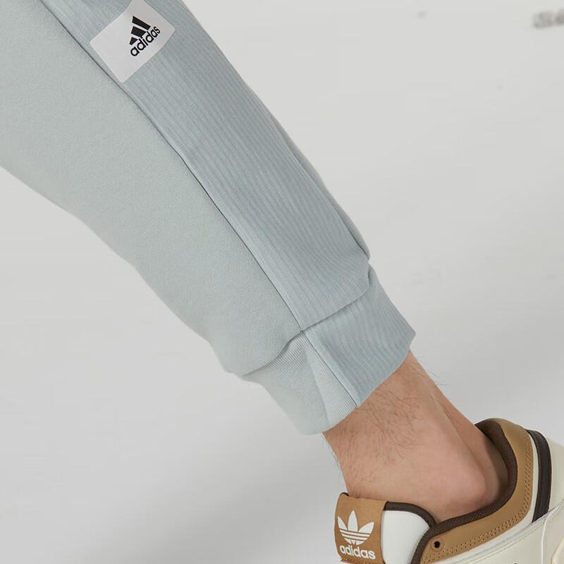 Adidas Jednobarevné ležérní pletené sportovní kalhoty s manžetou Pánské kalhoty Šedozelené IQ3413