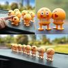 Car interior decoration decoration funny doll shaking head emoticons beautiful Internet red little idea