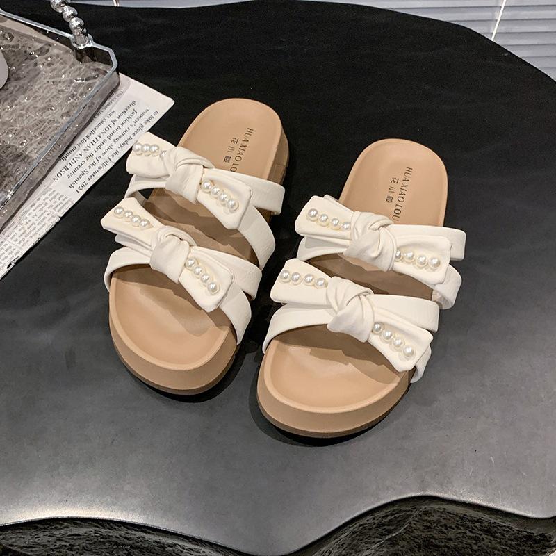 

Нежный бант красивые крутые тапочки женские летние 2025 новые с юбкой пляжные мягкие на плоской подошве тапочки на перемычке 40