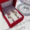 2025 Stylish Purple Flower Tassel Earrings with Zircon Studs - Luxury Design