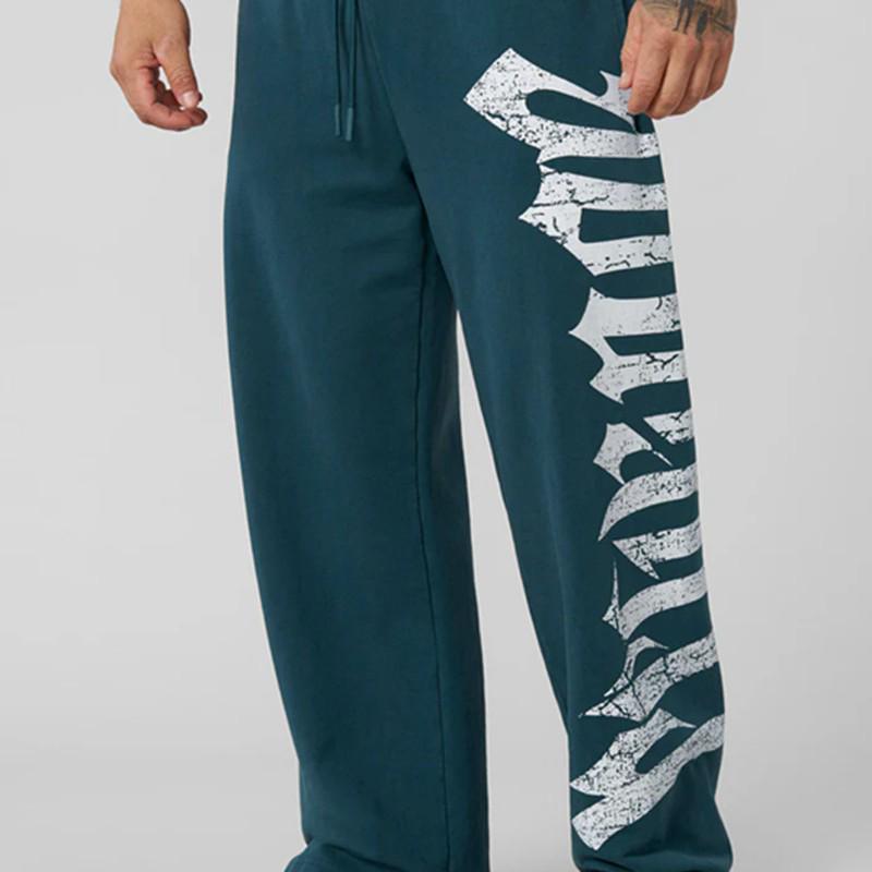 Pánské tepláky se širokými nohavicemi a velkým potiskem - Ležérní módní joggery