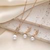 Simple faux pearl pendant necklace and earrings inlaid with rhinestones, creative spiral-shaped bridal accessories to match wedding dresses, suitable