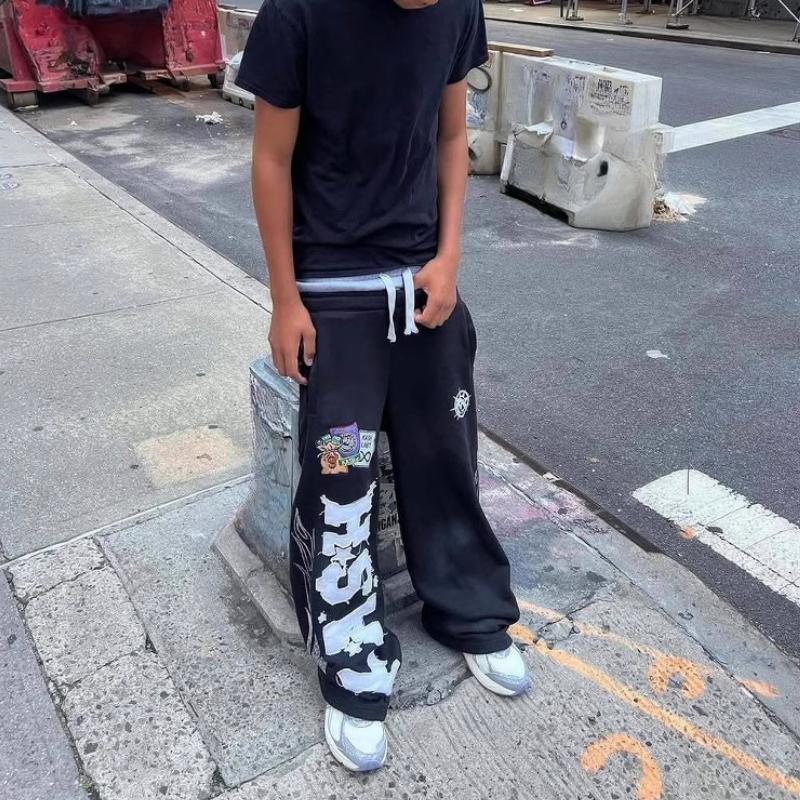 Tendência de rua europeia e americana masculina e feminina solta casual tubo reto tecido bordado calças estampadas