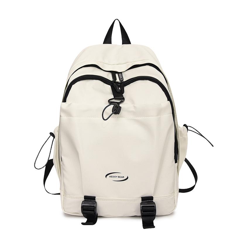 Koreansk version av enfärgad enkel och mångsidig ryggsäck med stor kapacitet för grundskoleelever