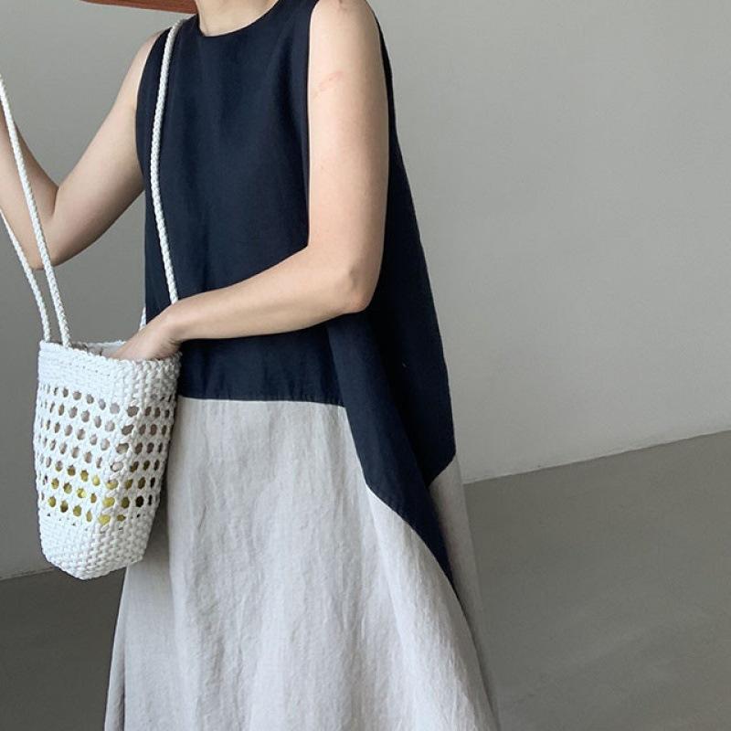 A Long Sleeveless Dress with A Vest Skirt