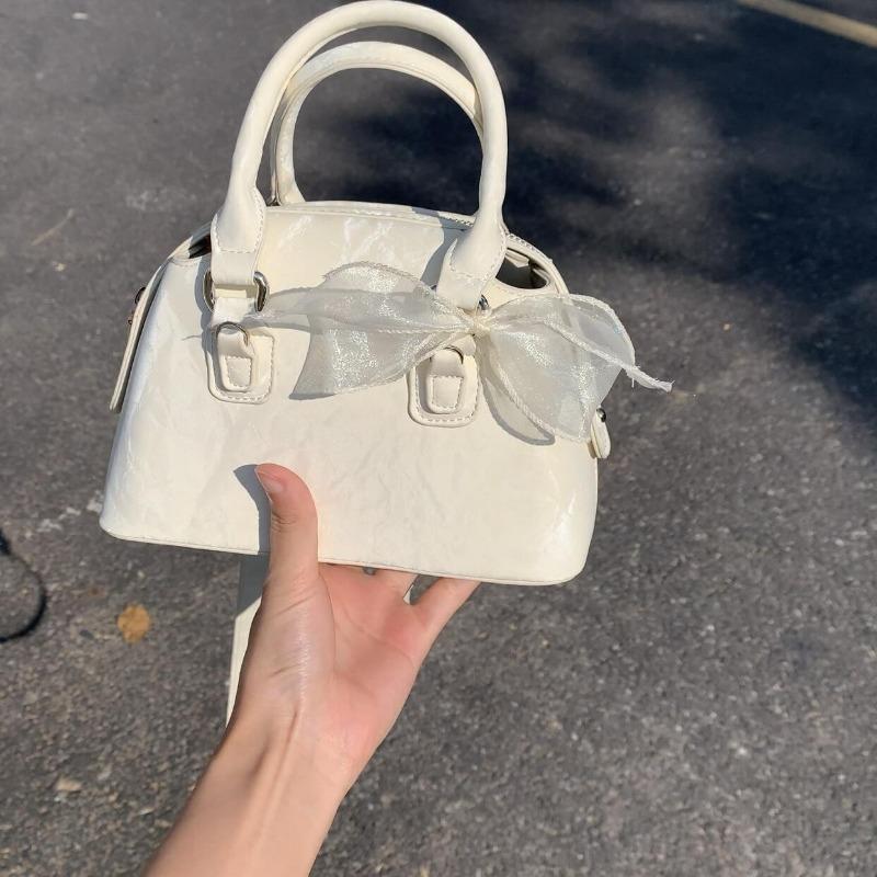 Lace Bow Boston Bag, A Textured and Fashionable Crossbody Bag, A Commuter Shell Bag