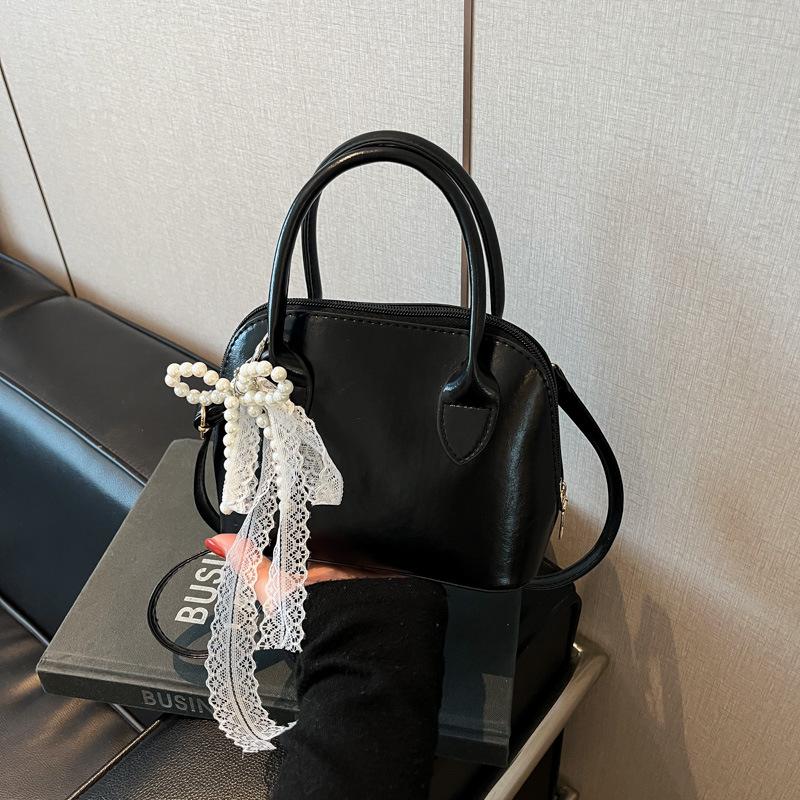 Korean Niche Fashionable Portable Shell Bag Women's 2025 Spring New Foreign Style High Value Single Shoulder Messenger Bag