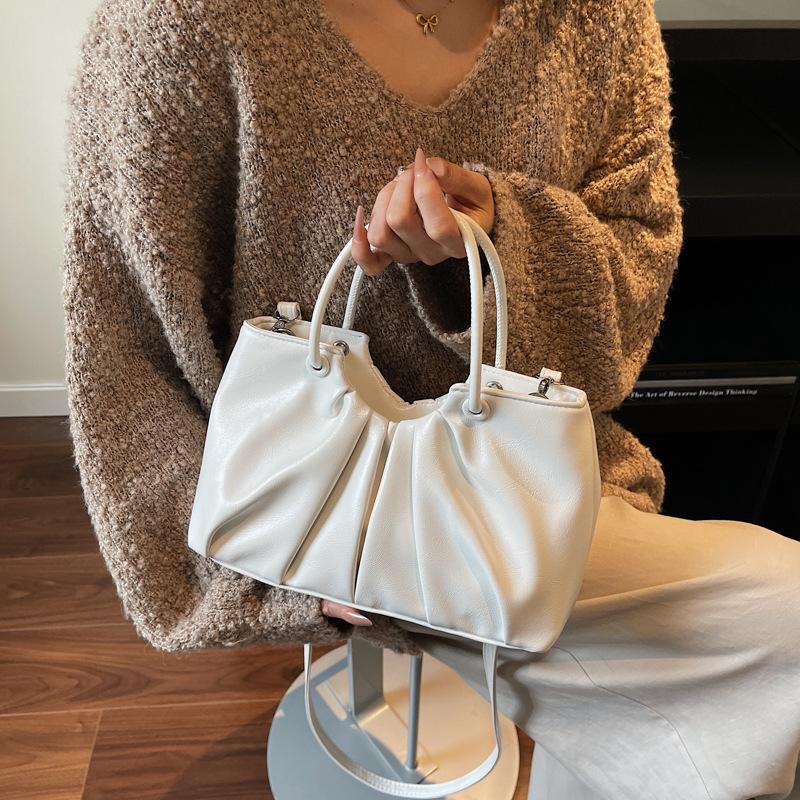 

This year, niche pleated cloud bags are popular for women s 2025 new retro texture casual portable messenger tote bags.