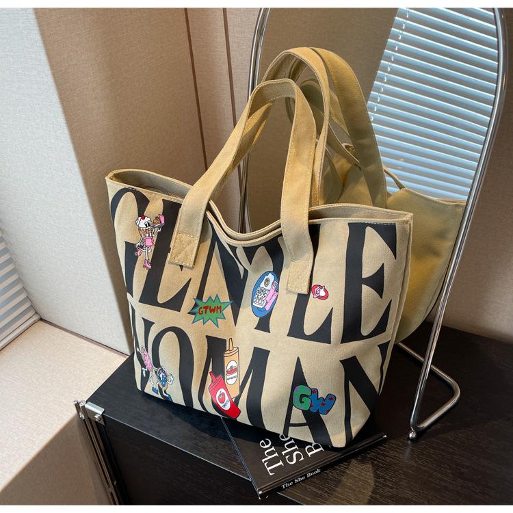Canvas bag Women's large-capacity printed alphabet portable shoulder commuter tote bag Fashion new