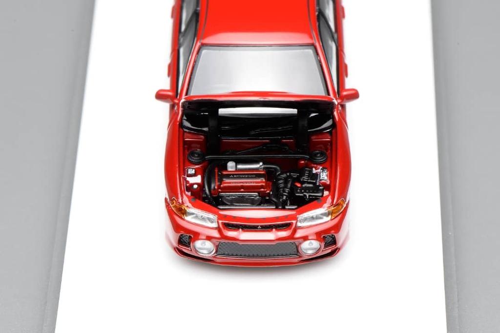 FREESTYLE MOTORHELIX Mitsubishi Lancer Evolution IV Palma Red Finished Model M64008 1/64