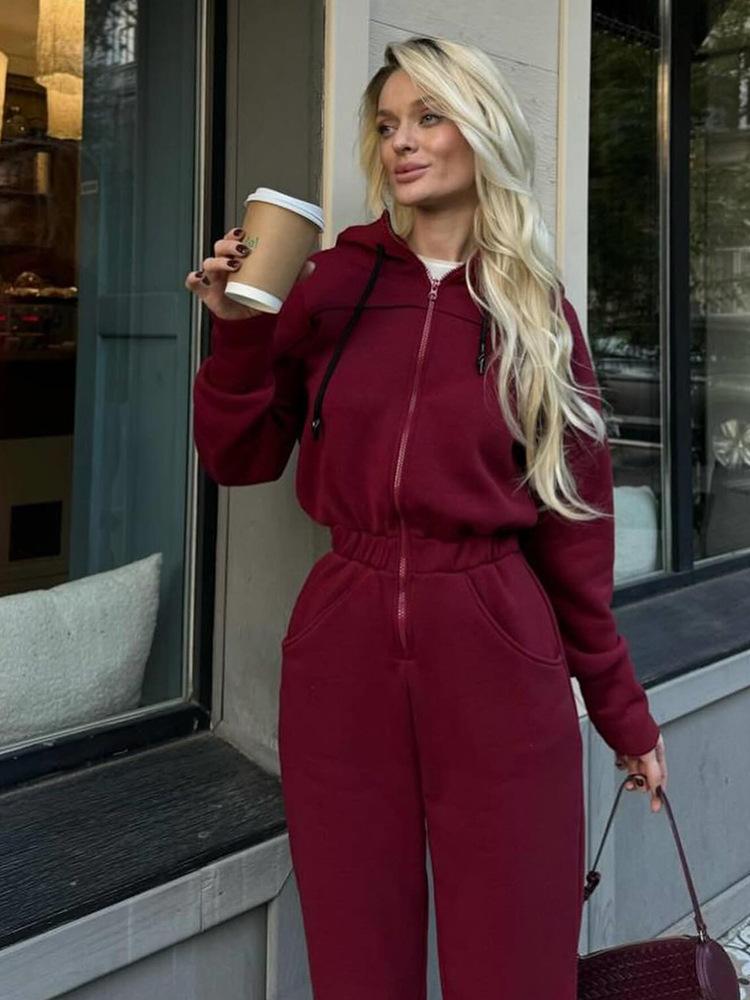Tuta intera da donna casual europea e americana con cappuccio in vita a tinta unita a maniche lunghe con cerniera sportiva intera