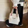 Casual alphabet canvas bag Women's large-capacity portable tote bag Bento bag Student lunch box bag Hand carry storage bag