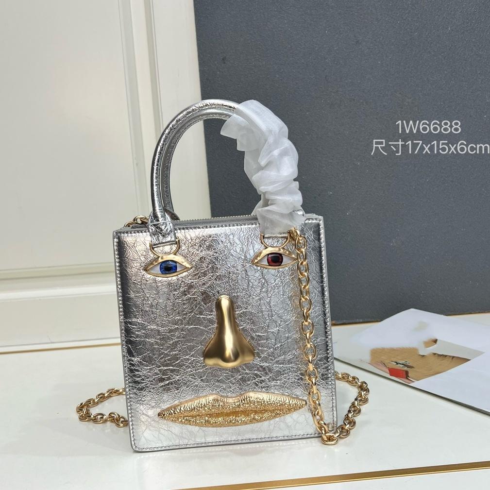 26 trendy new schiap face women's bag plain weave cowhide chain design sense hand-held tote bag