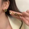 Light luxury high-end French retro concentric knot earrings design temperament versatile New Year's earrings autumn and winter earrings