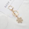 Christmas Snowflake Metal Keychain Set: Exquisite Small Hollow Gold Pendants