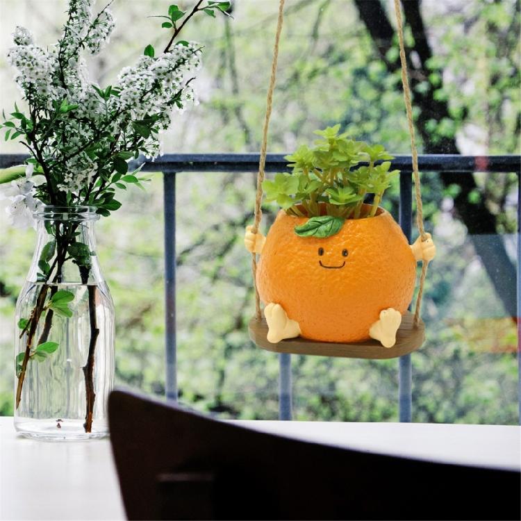 Creative Multifunctional Orange Swing Planter Pot With Swing Feature Suitable for Kids Entertainment and Home Gardening