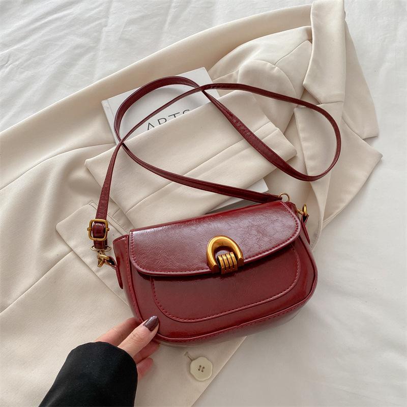 Saddle bag women's spring 2025 new clamshell shoulder messenger bag women's niche design underarm women's bag tide