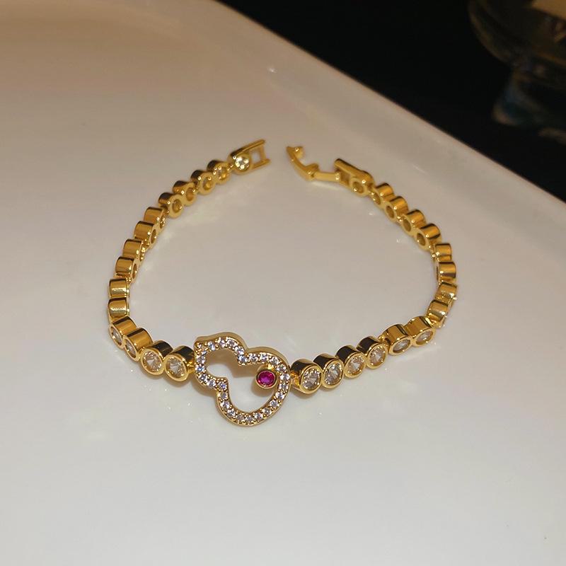 

Золотой гальванизированный цирконовый браслет в форме тыквы: Яркие, роскошные и универсальные украшения для женщин во французском стиле Bracelet-Gold (Real Gold Electroplating) золотой