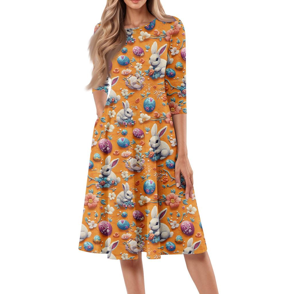 Dámské volné ležérní a módní šaty střední délky s potiskem, kulatým výstřihem a sedmčtvrtečními rukávy