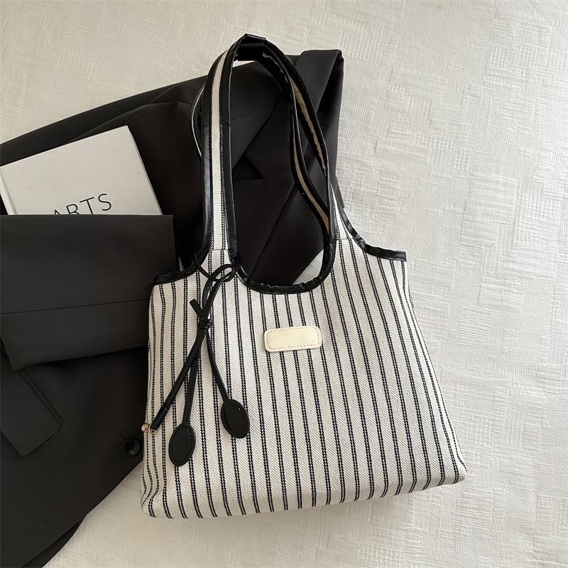 Large capacity tote bag women's new versatile canvas striped commuter shoulder bag women's casual armpit bag