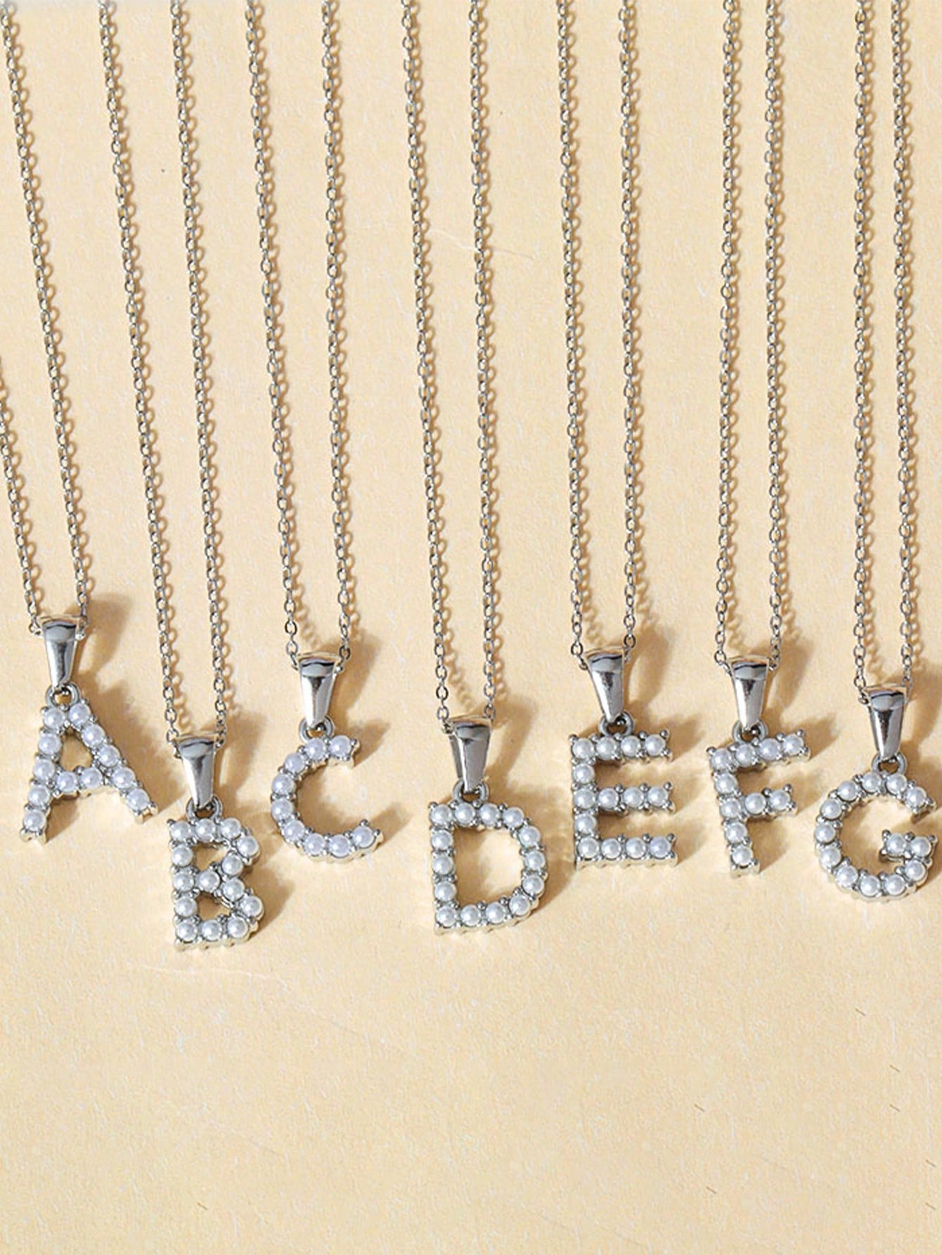 

One piece fashion 26 letters A-Z pendant stainless steel exquisite O chain imitation pearl alphabet pendant necklace Z серебряный