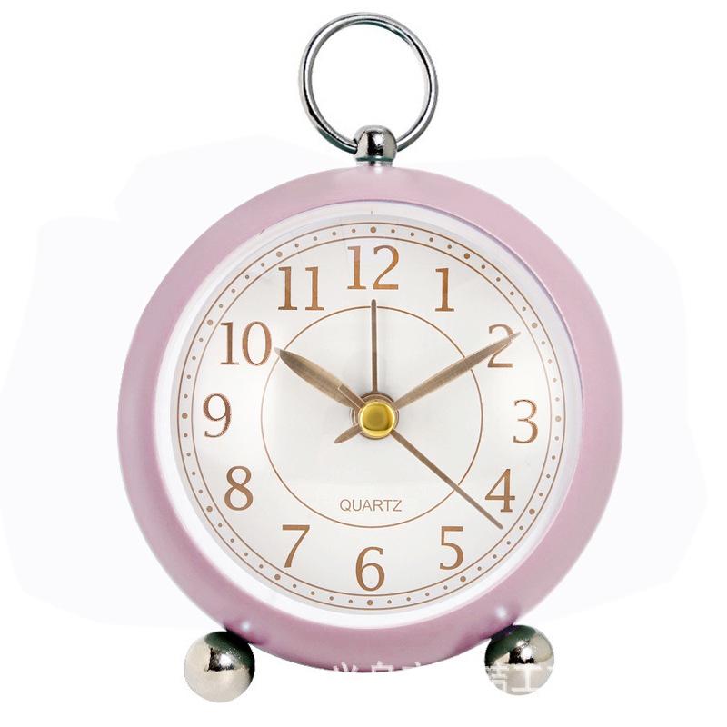 Silent Metal Alarm Clock with Night Light and Gold Stamped Spherical Face - Perfect for Students and Children.