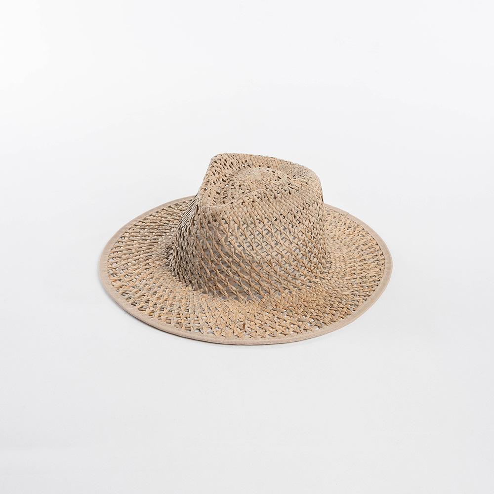 Spring and summer new fashionable and simple hand-woven hollow pattern natural straw hat outdoor beach travel sunscreen sunshade straw hat