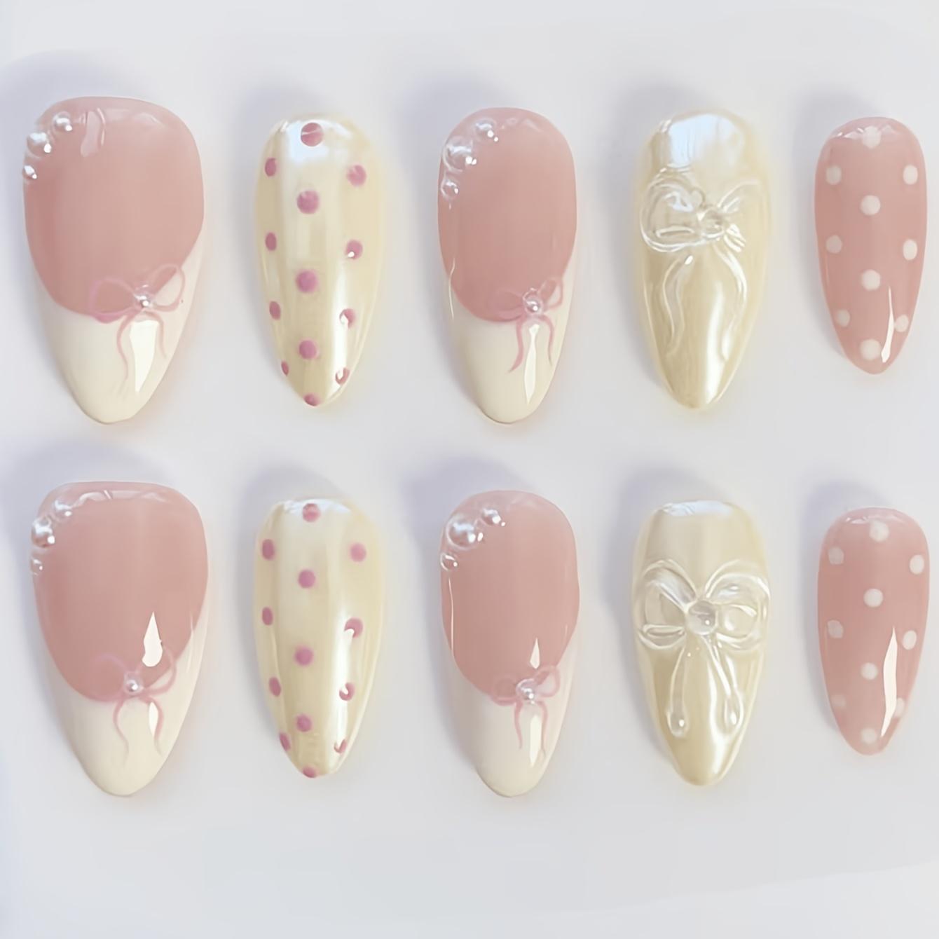 

almond epoxy press-on nails, nude yellow white tones with polka dot, bow and pearl decor. Glossy French full-cover removable nails for daily wear 30pcs
