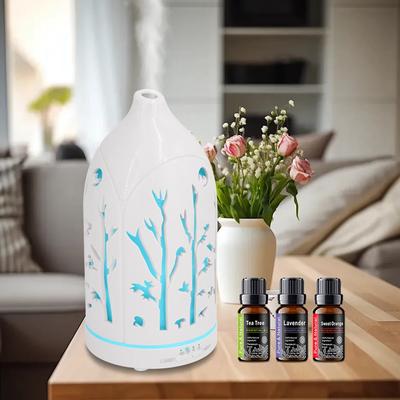 Diffuseur d'aromathérapie 7 couleurs ajouré Comprend 3 huiles essentielles, arrêt automatique et fonctionnement silencieux