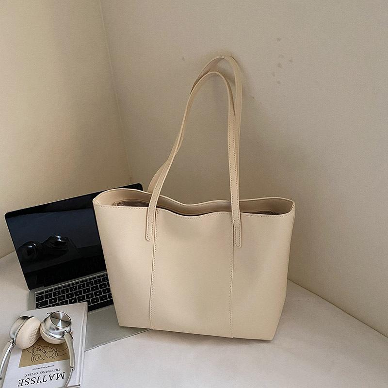 

Solid color large-capacity tote bag women s 2025 autumn new handbag niche foreign style daily commuting shoulder bag