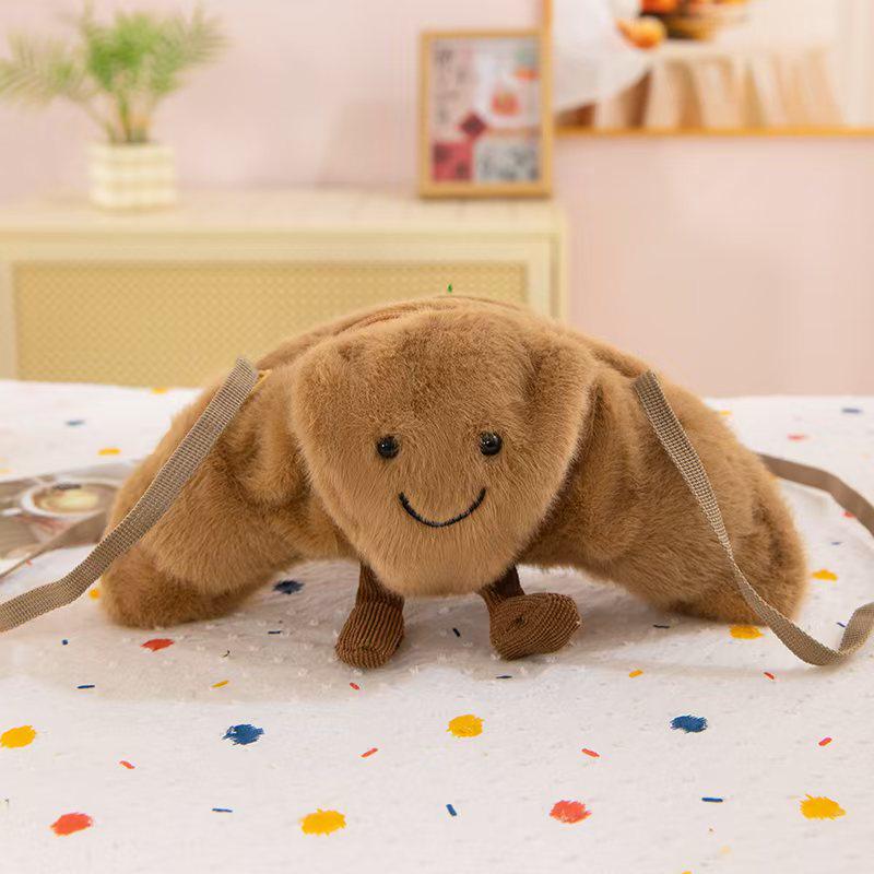 

Очаровательная сумка кроссбоди в виде круассана - плюшевый подарок для модных кукол для девочек, гурманов и законодателей моды 20 cm темно-коричневого